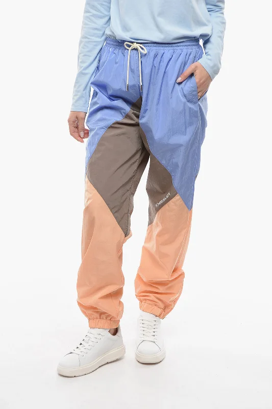 soft pajama cozy pants -Khrisjoy Colorblock Nylon Joggers with Ankle Zip